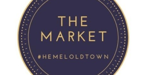 A circular logo featuring the text "THE MARKET" in bold gold letters on a dark blue background, with the hashtag "#HEMELOLDTOWN" at the bottom.