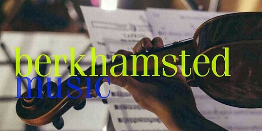 A close-up of a hand holding a violin, with musical sheets in the background. The text "berkhamsted music" is prominently displayed in colorful fonts.